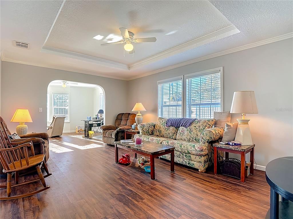 1824 Riverside Drive Moore Haven, FL 33471 - Photo 30 of 66 a living room with furniture and a chandelier
