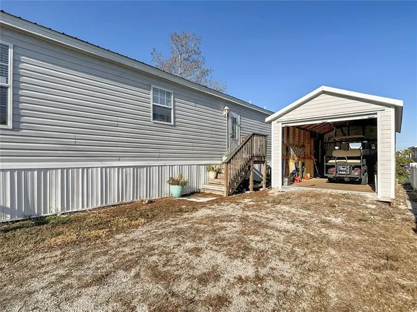 an aerial view of a house with lake view and mountain view