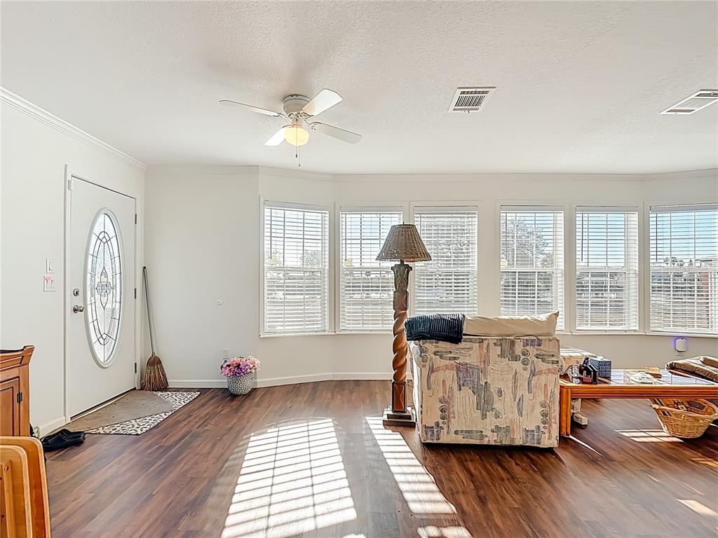 1824 Riverside Drive Moore Haven, FL 33471 - Photo 5 of 66 a living room with furniture and wooden floor