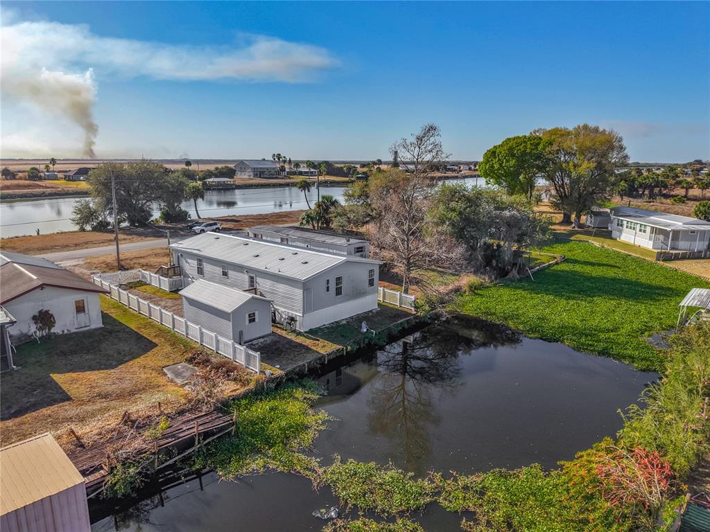 1824 Riverside Drive Moore Haven, FL 33471 - Photo 56 of 66 an aerial view of a house with a garden