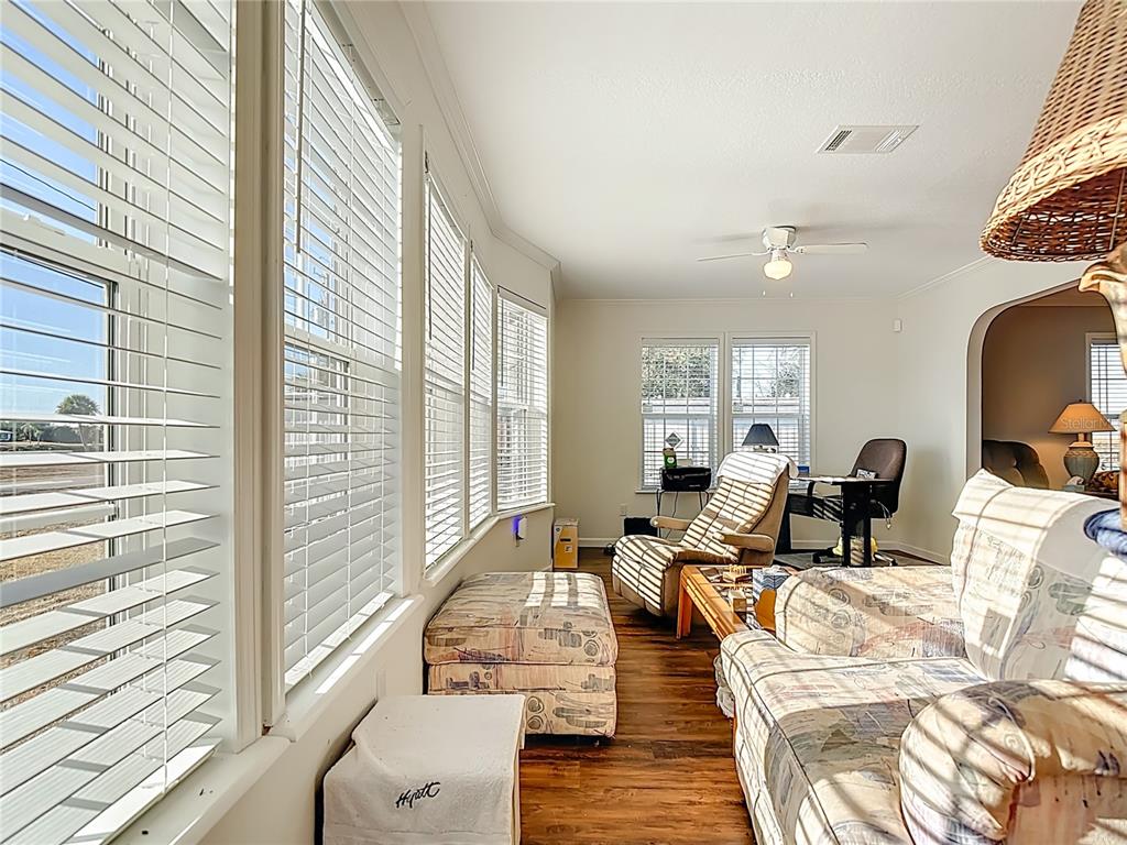 1824 Riverside Drive Moore Haven, FL 33471 - Photo 9 of 66 a living room with furniture window and wooden floor