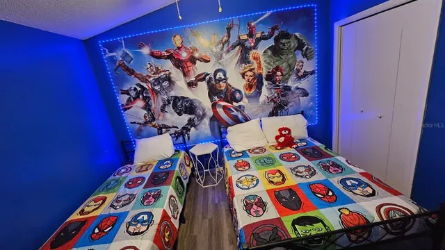 a view of a bedroom with a bed and a dresser