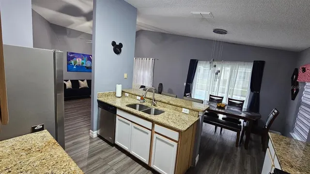 a kitchen that has a stove and a table