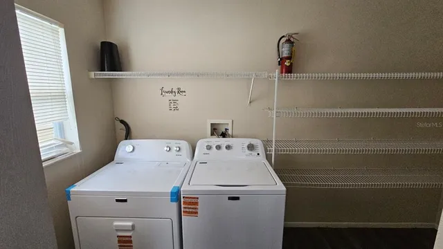 a utility room with dryer and washer