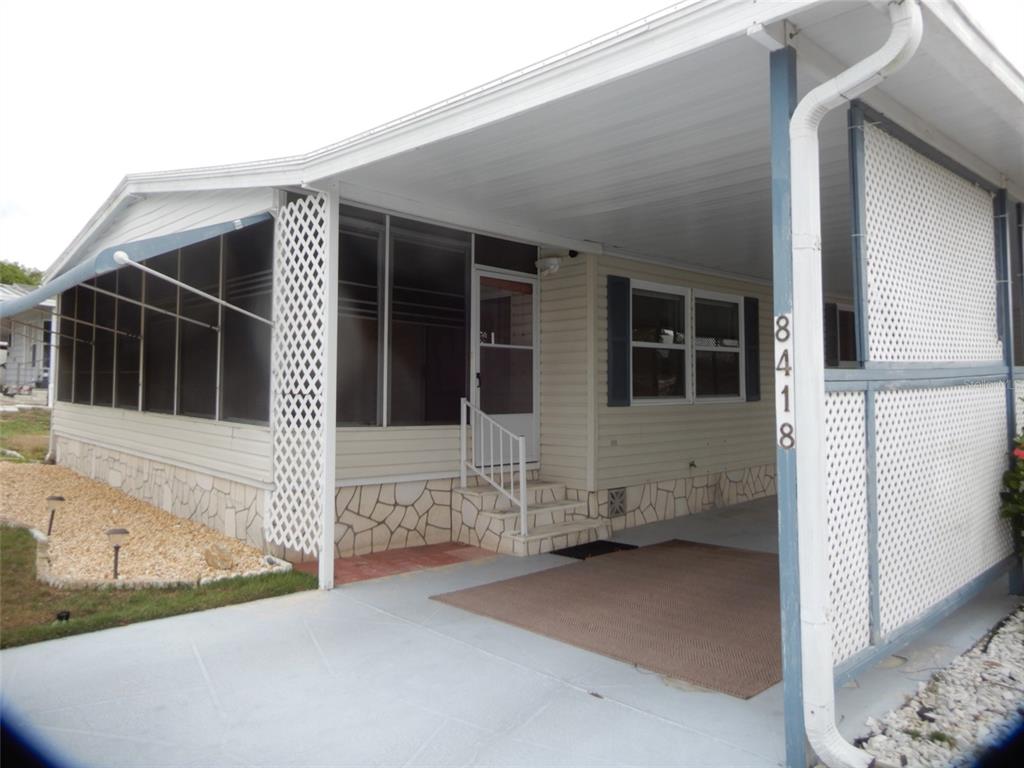 8418 Central Avenue Brooksville, FL 34613 - Photo 1 of 1 a view of front of house with wooden fence