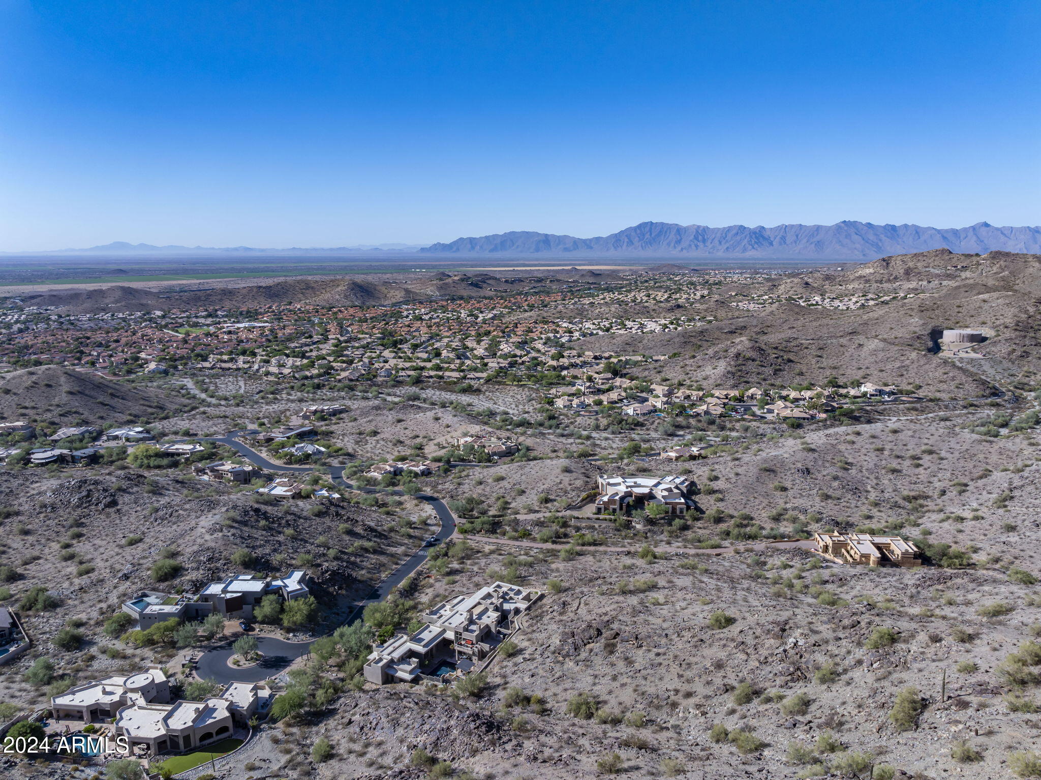 14008 South Rockhill Road, Unit 40 Phoenix, AZ 85048 - Photo 10 of 31 a view of a large mountain with mountains in the background