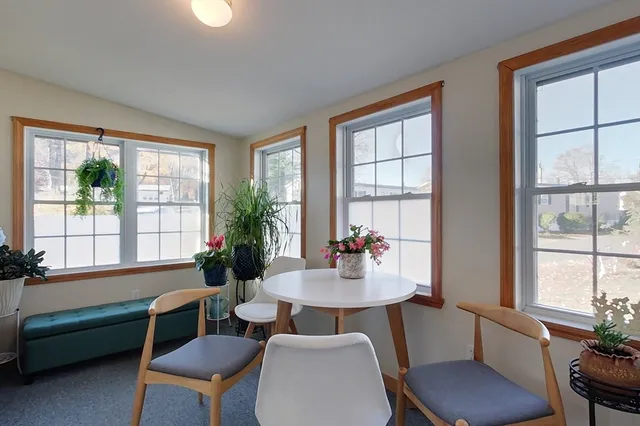 a view of a dining room with furniture window and outside view