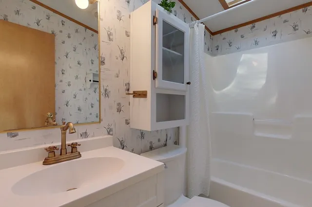 a bathroom with a bathtub and a sink