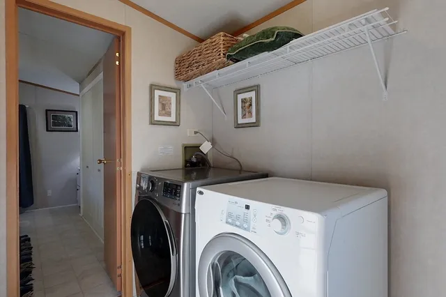 a view of storage and utility room with washer and dryer