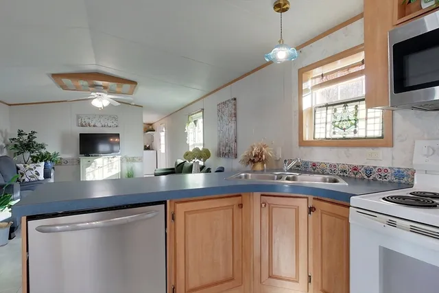a kitchen with sink and window