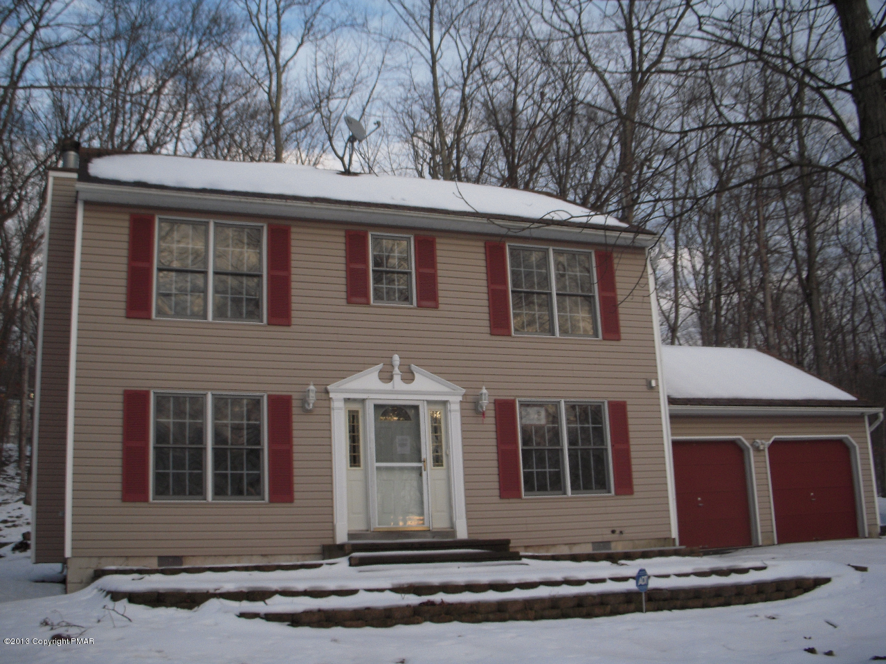 1227 Salisbury Road Bushkill, PA 18324 - Photo 1 of 15 a front view of a house with a yard