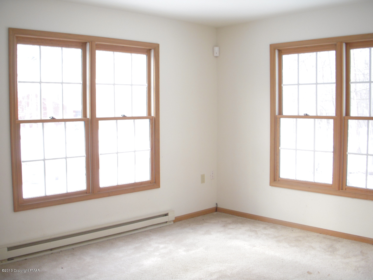 1227 Salisbury Road Bushkill, PA 18324 - Photo 2 of 15 an empty room with a window