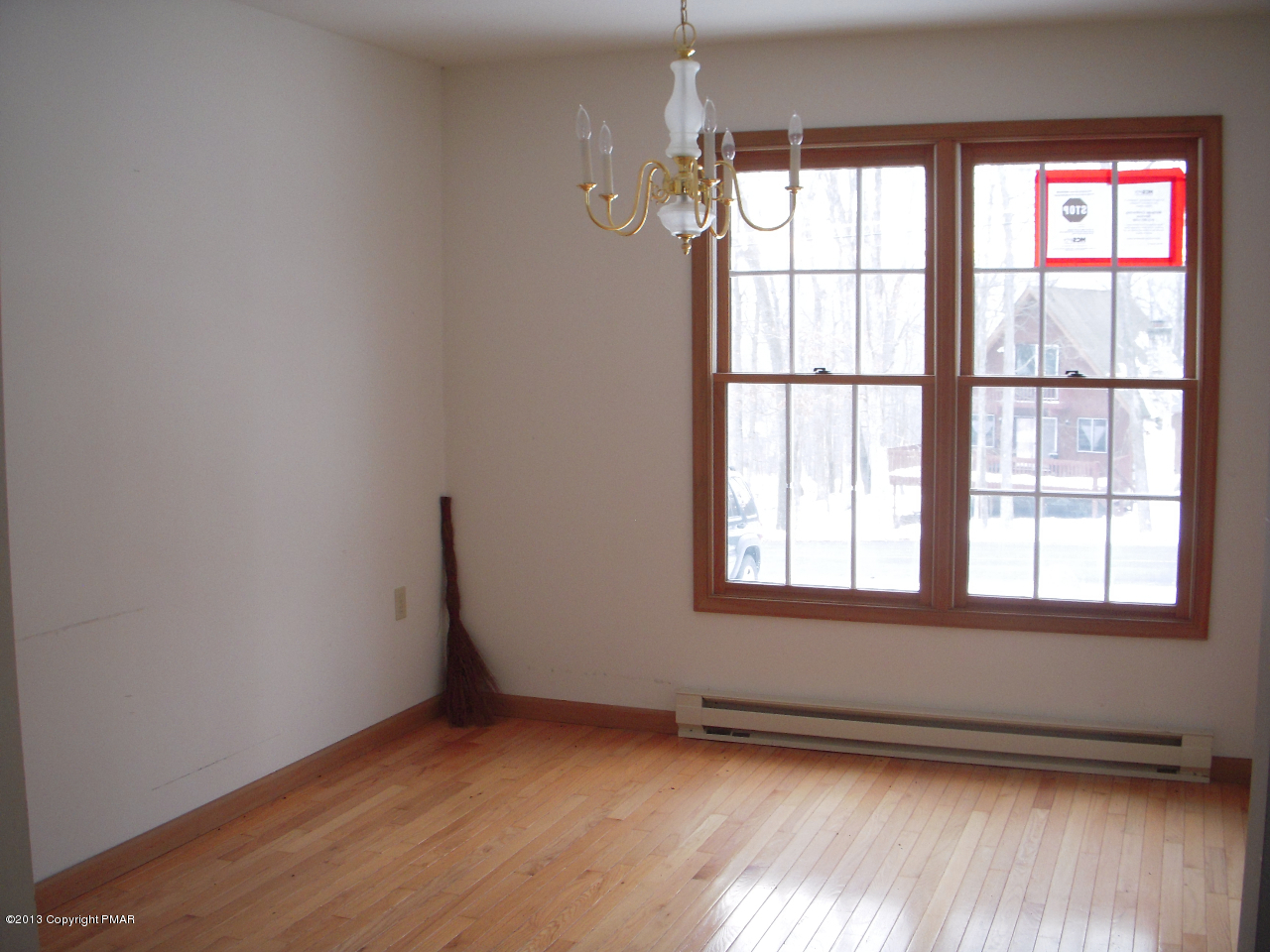 1227 Salisbury Road Bushkill, PA 18324 - Photo 3 of 15 an empty room with wooden floor and windows
