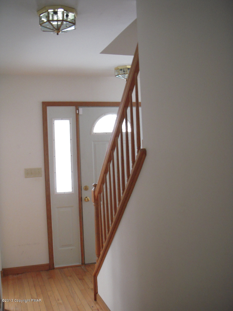 1227 Salisbury Road Bushkill, PA 18324 - Photo 8 of 15 a view of staircase with wooden floor and stairs