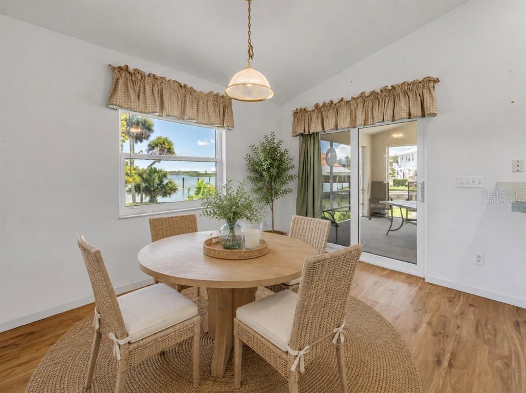 192 Azalea Road Edgewater, FL 32141 - Photo 31 of 94 a view of a dining room with furniture window and wooden floor