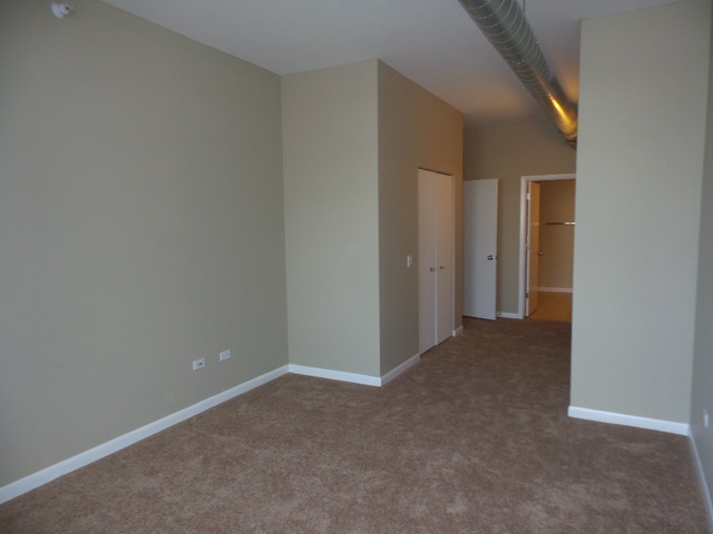 1200 West Monroe Street, Unit 803 Chicago, IL 60607 - Photo 12 of 12 a view of an empty room