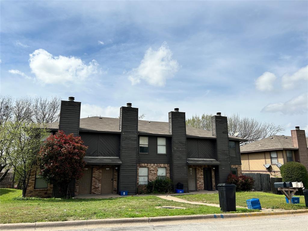 3816 Coates Circle Benbrook, TX 76116 - Photo 1 of 1 a view of a brick house next to a yard