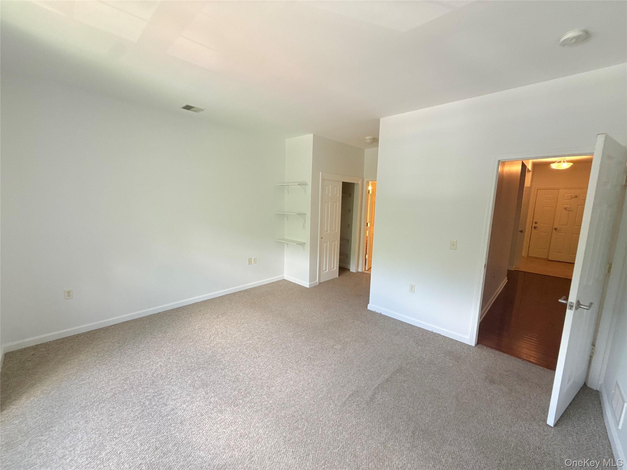 935 Tower Ridge Circle Middletown, NY 10941 - Photo 4 of 24 Carpeted room featuring light neutral walls and baseboards