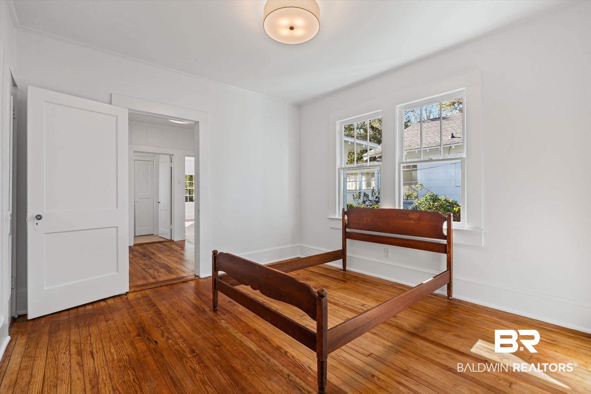 2153 Old Government Street Mobile, AL 36606 - Photo 16 of 23 Bedroom with hardwood / wood-style flooring and baseboards