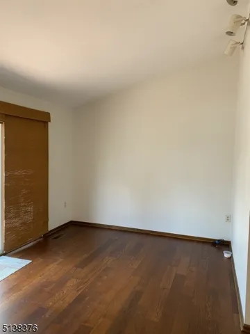 an empty room with a bench