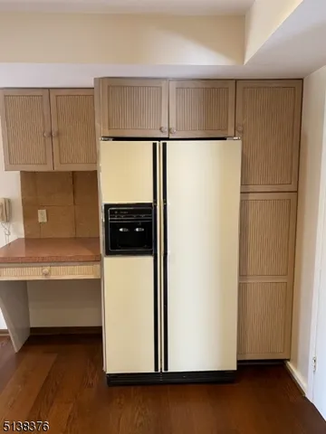 a white refrigerator freezer sitting in a kitchen