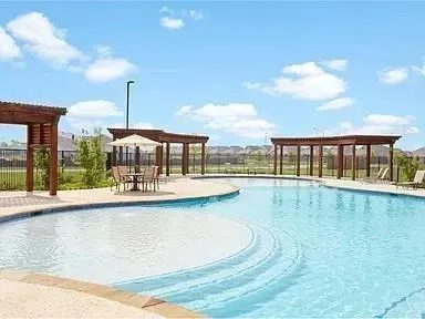 a view of a swimming pool and outdoor space