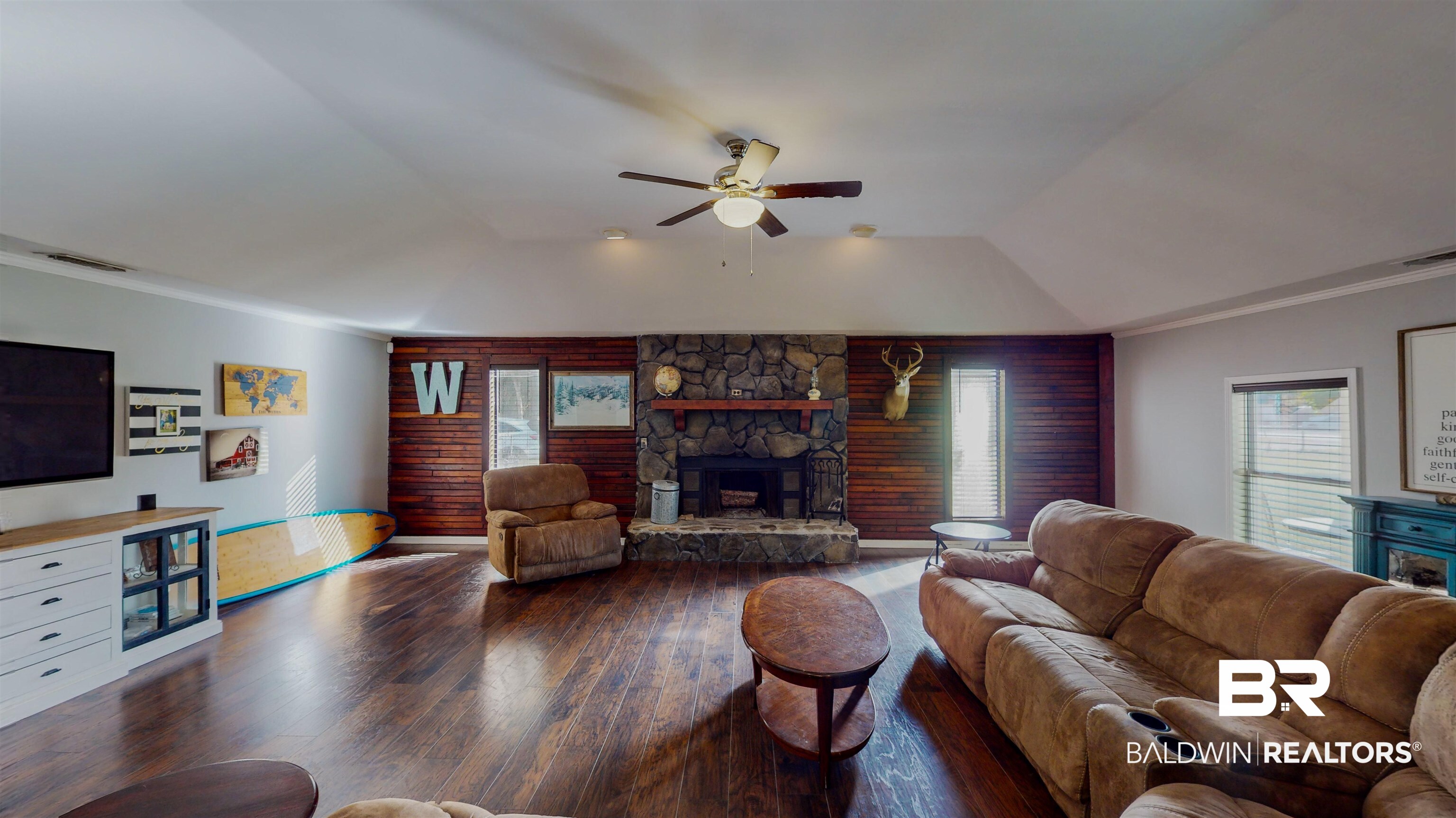 19365 Keller Road Foley, AL 36535 - Photo 13 of 41 Living room featuring lofted ceiling, a fireplace, dark hardwood / wood-style floors, ornamental molding, and ceiling fan