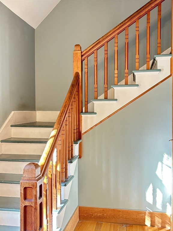 527 Main Street, Unit 2 Ashfield, MA 01330 - Photo 14 of 27 a view of staircase with white walls and railing