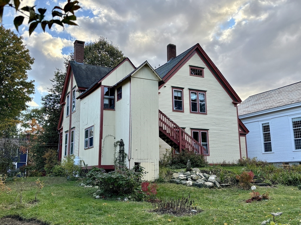 527 Main Street, Unit 2 Ashfield, MA 01330 - Photo 25 of 27 a view of a house with a yard and plants