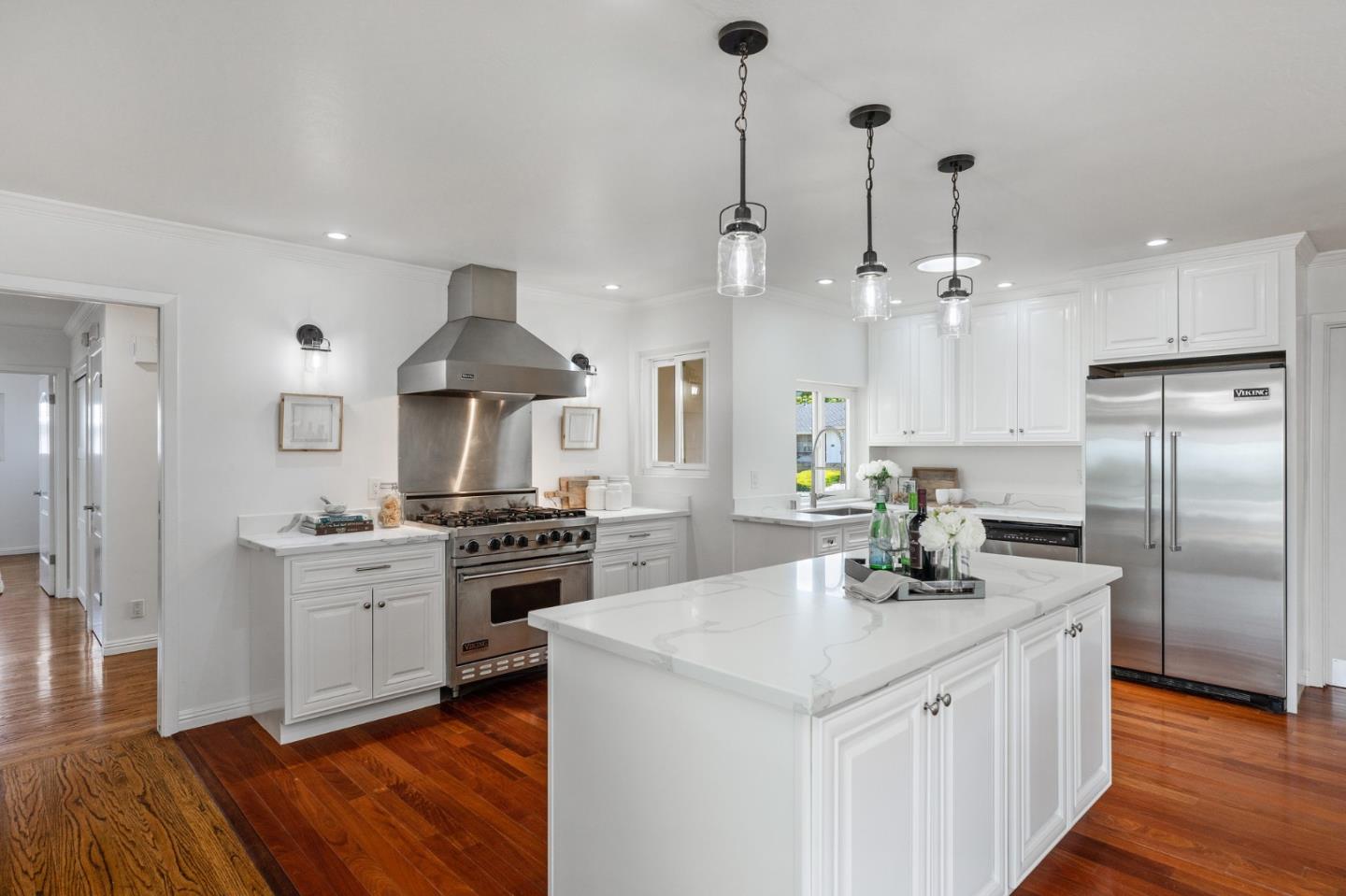 1808 Castenada Drive Burlingame, CA 94010 - Photo 11 of 37 a kitchen with stainless steel appliances kitchen island granite countertop a sink a stove and a refrigerator