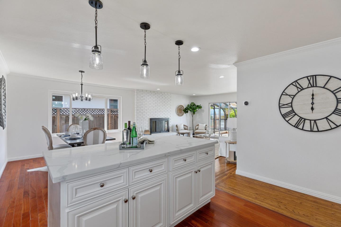 1808 Castenada Drive Burlingame, CA 94010 - Photo 13 of 37 a kitchen with counter top space cabinets and wooden floor