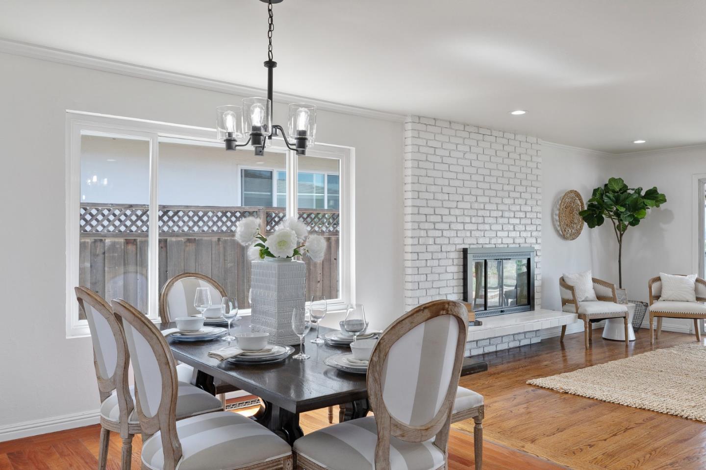 1808 Castenada Drive Burlingame, CA 94010 - Photo 16 of 37 a dining room with furniture a chandelier and window
