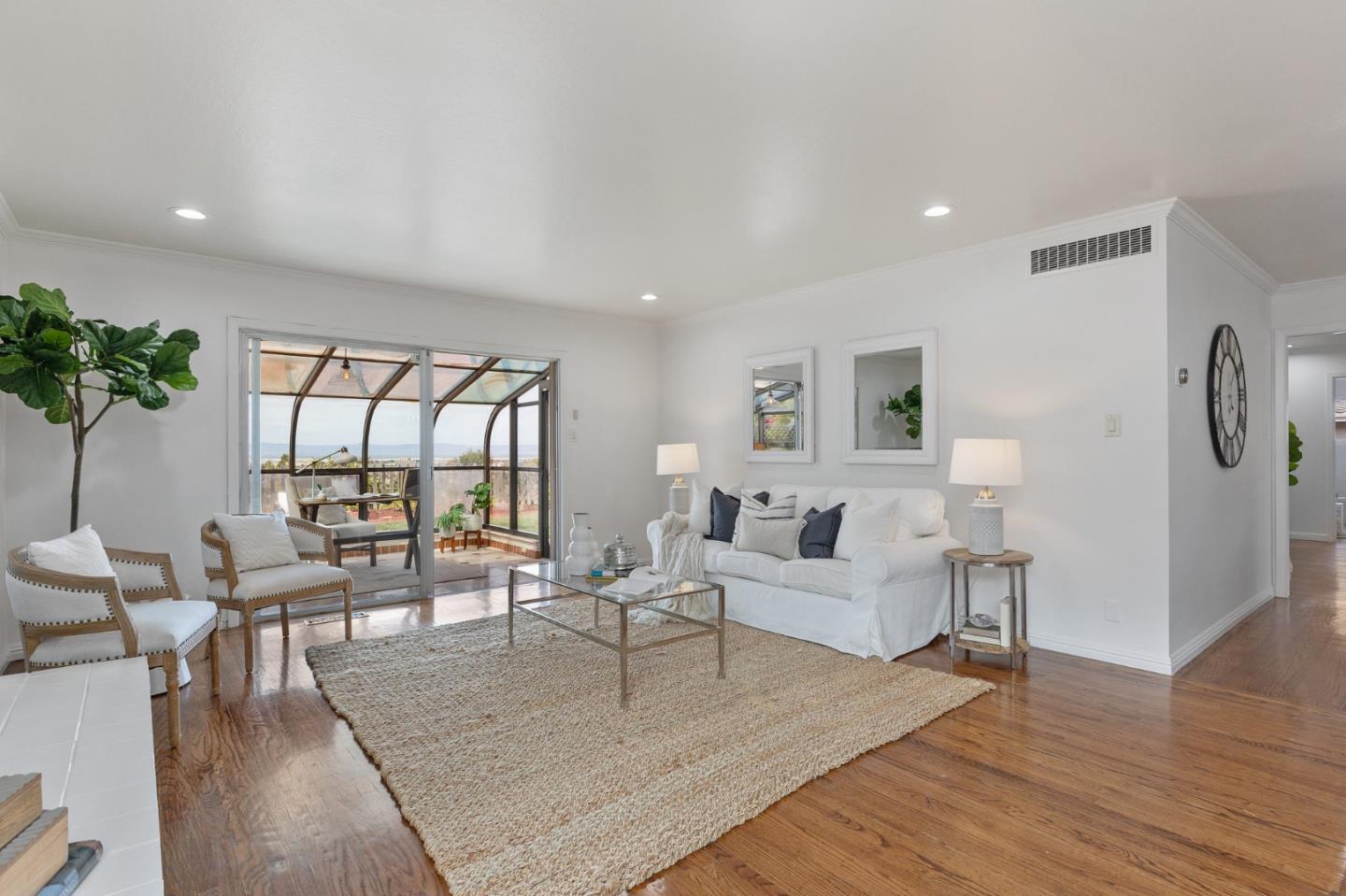 1808 Castenada Drive Burlingame, CA 94010 - Photo 17 of 37 a living room with furniture large window and wooden floor