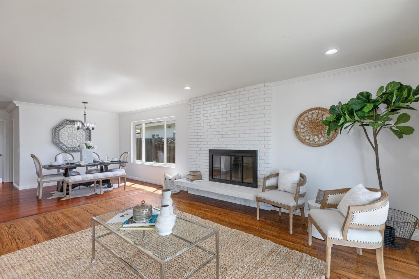 1808 Castenada Drive Burlingame, CA 94010 - Photo 18 of 37 a living room with furniture a table and a fireplace
