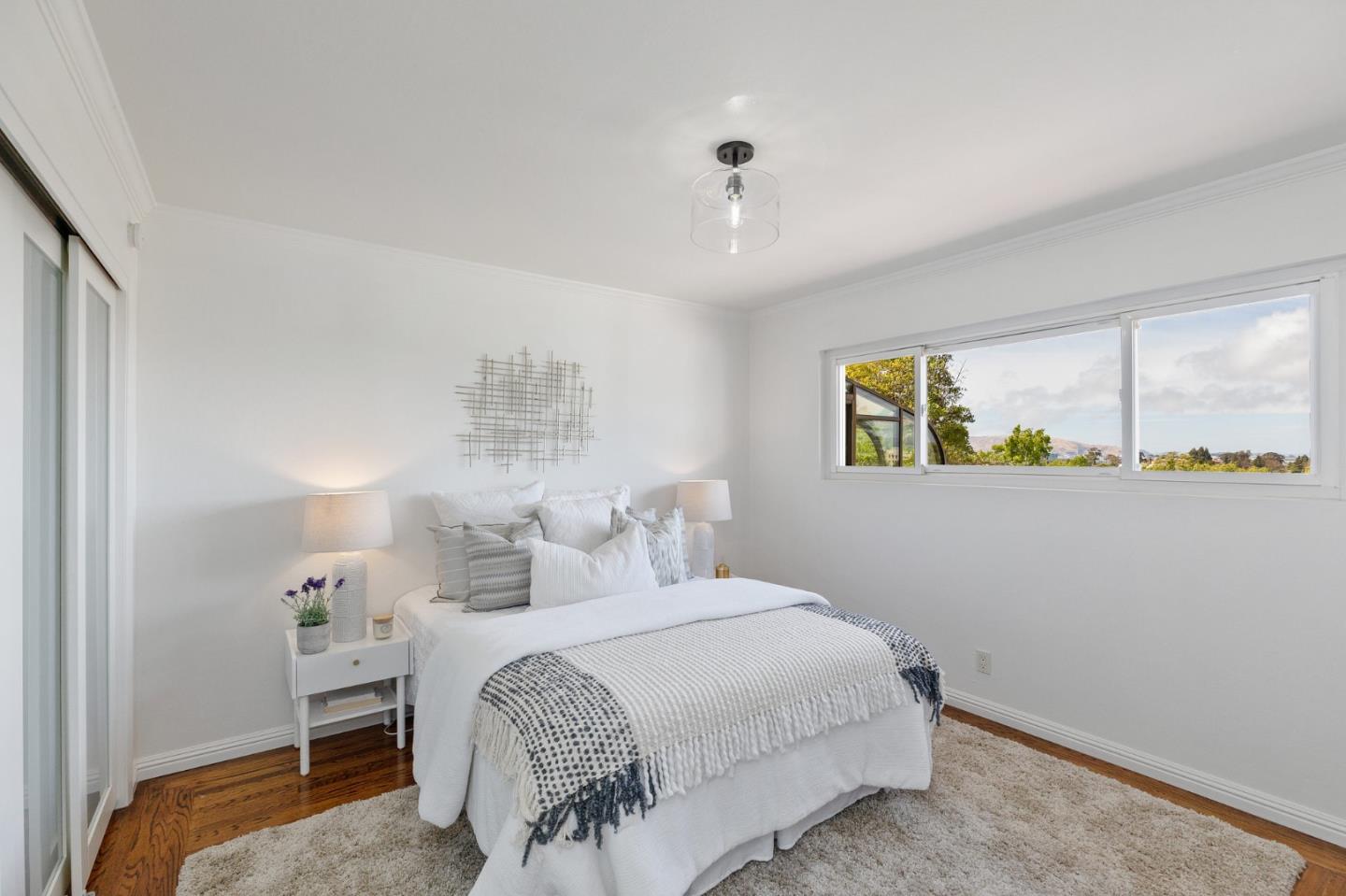 1808 Castenada Drive Burlingame, CA 94010 - Photo 22 of 37 a bedroom with a bed and a window
