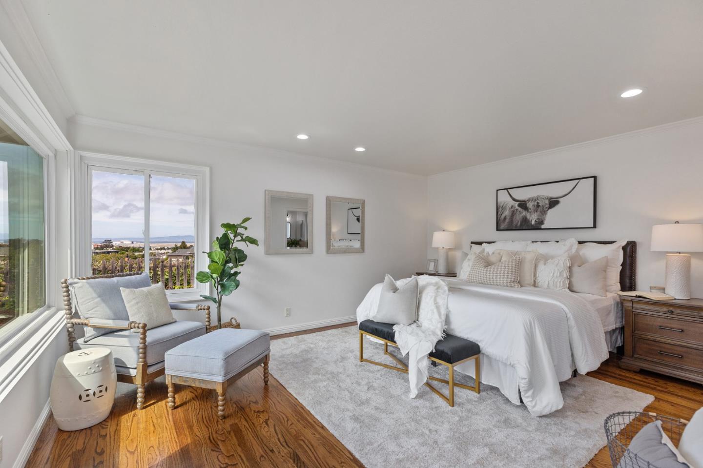 1808 Castenada Drive Burlingame, CA 94010 - Photo 27 of 37 a spacious bedroom with a bed and a couch