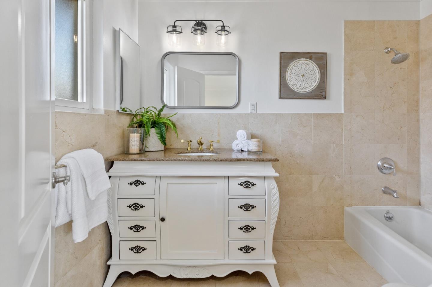1808 Castenada Drive Burlingame, CA 94010 - Photo 30 of 37 a bathroom with a tub sink and mirror