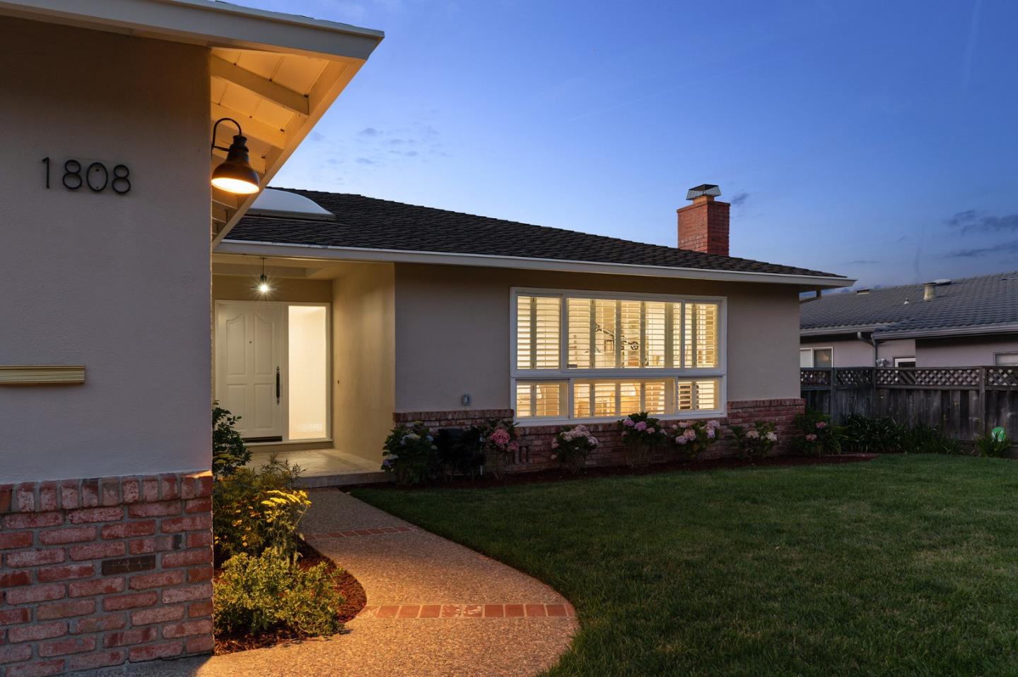 1808 Castenada Drive Burlingame, CA 94010 - Photo 3 of 37 a front view of a house with garden
