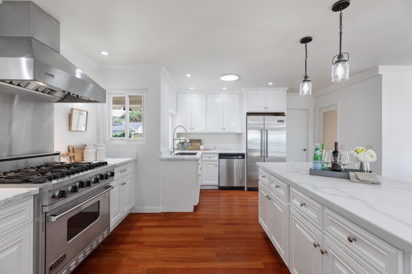 1808 Castenada Drive Burlingame, CA 94010 - Photo 10 of 37 a kitchen with stainless steel appliances kitchen island a sink and a stove
