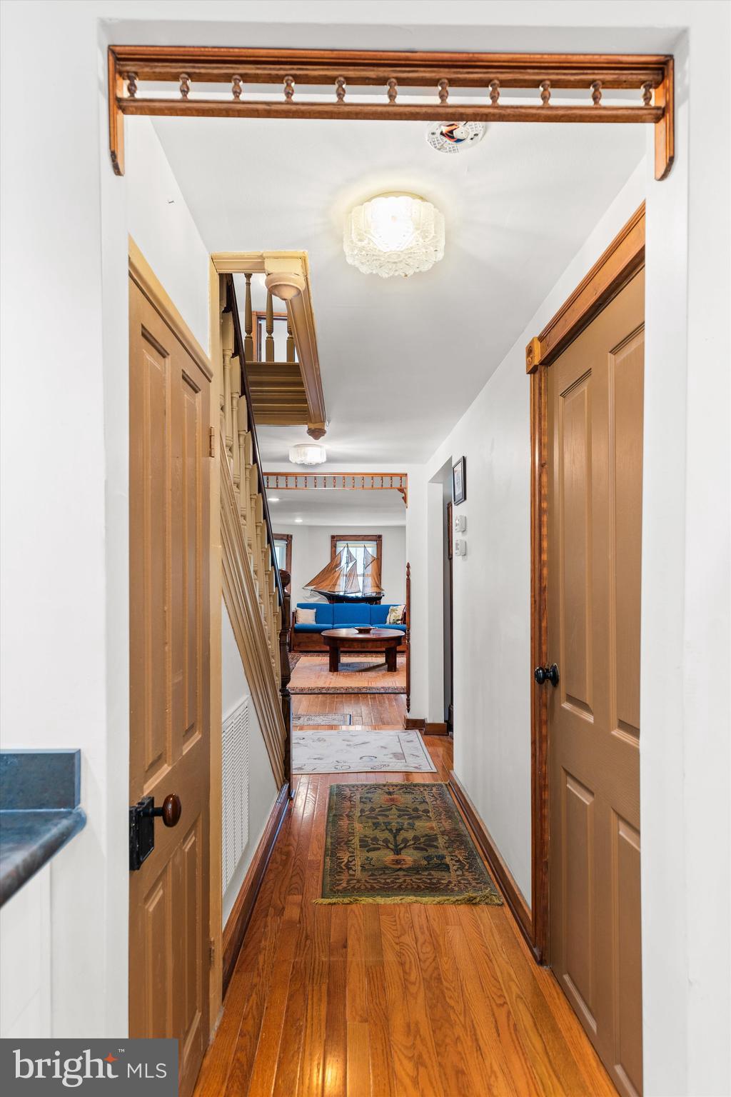 4665 Tyaskin Road Tyaskin, MD 21865 - Photo 11 of 40 a view of a hallway with wooden floor and staircase