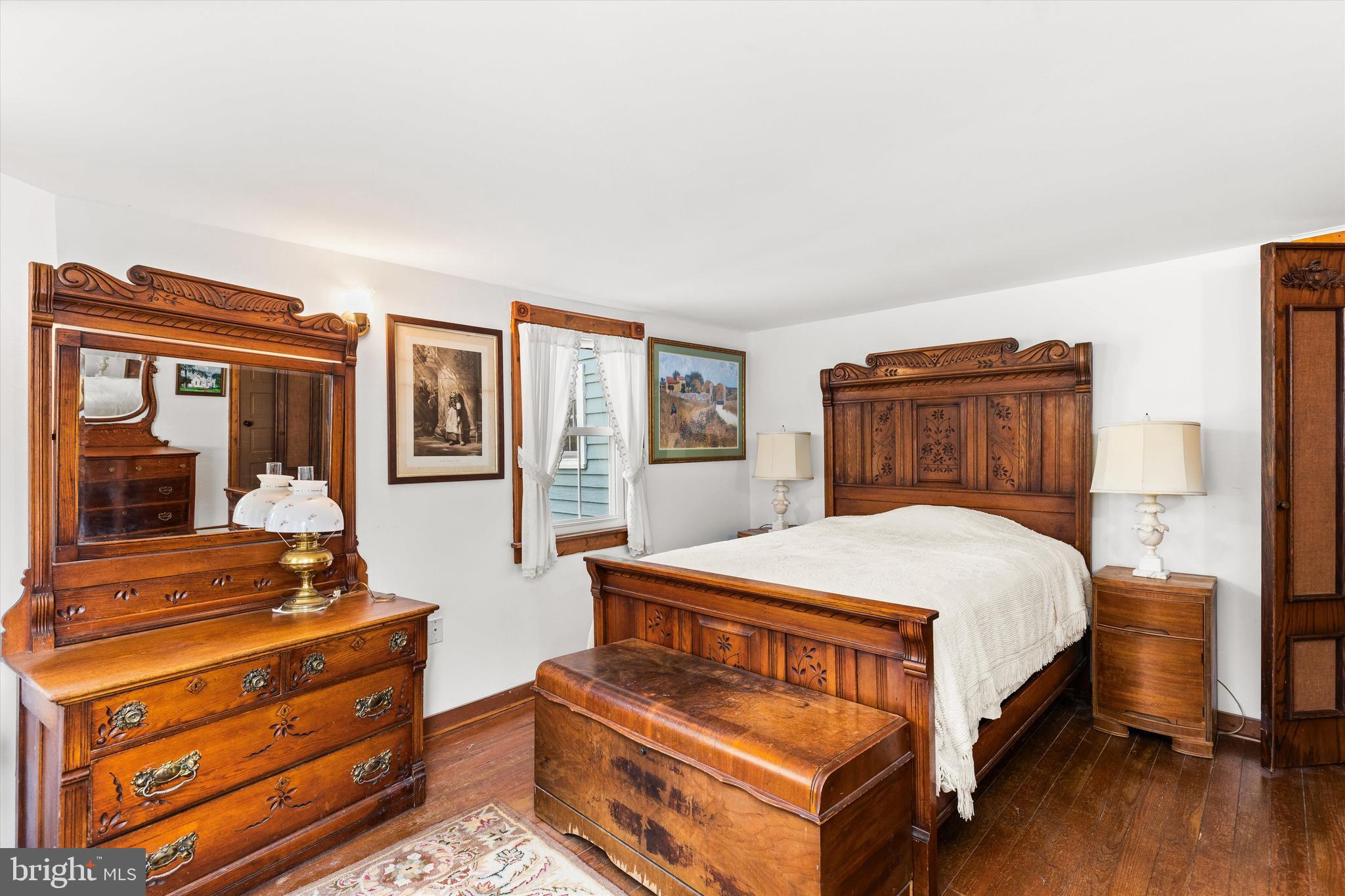 4665 Tyaskin Road Tyaskin, MD 21865 - Photo 21 of 40 a bedroom with a bed and wooden floor