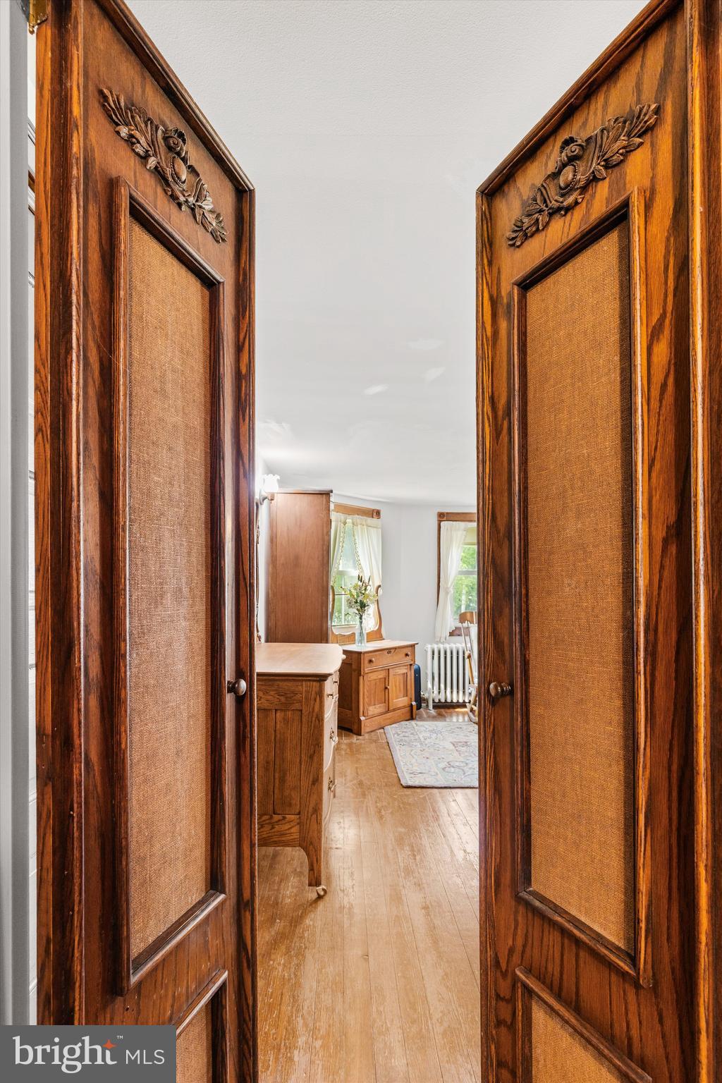 4665 Tyaskin Road Tyaskin, MD 21865 - Photo 23 of 40 a view of a hallway with wooden floor and furniture