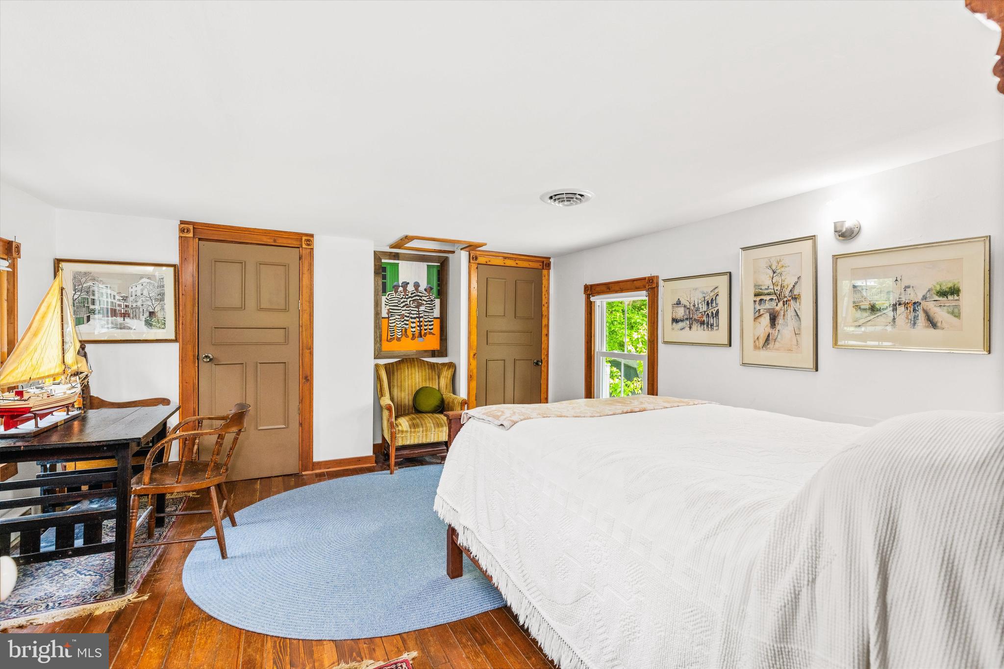 4665 Tyaskin Road Tyaskin, MD 21865 - Photo 36 of 40 a bedroom with a bed and wooden floor