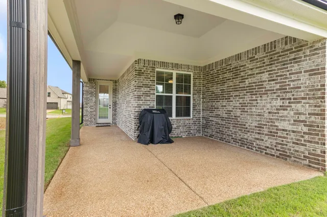 a view of an empty room and fire place