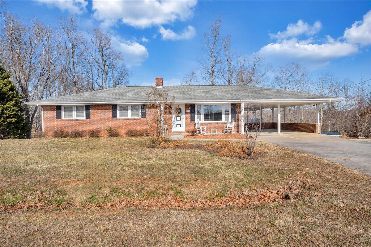 3400 Dillons Fork Road Fieldale, VA 24089 - Photo 1 of 45 a front view of a house with a garden