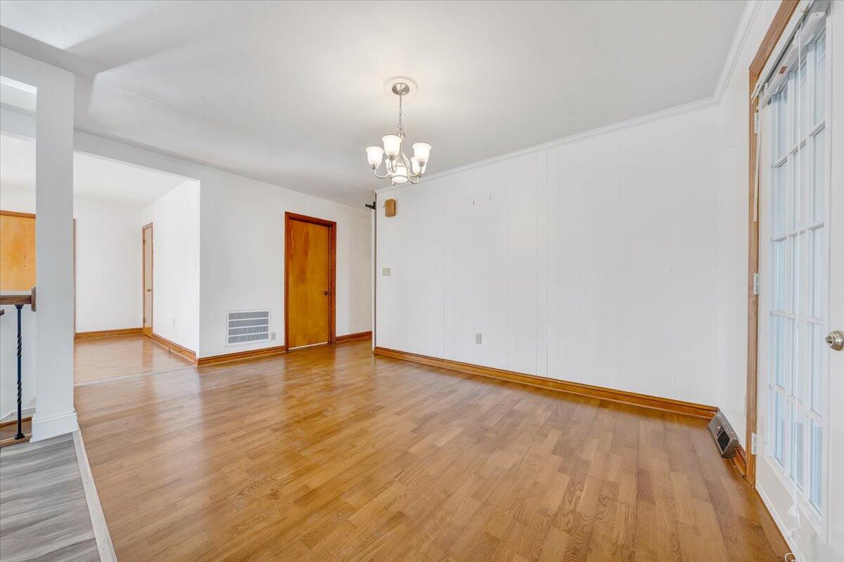 3400 Dillons Fork Road Fieldale, VA 24089 - Photo 12 of 45 wooden floor in an empty room with a window