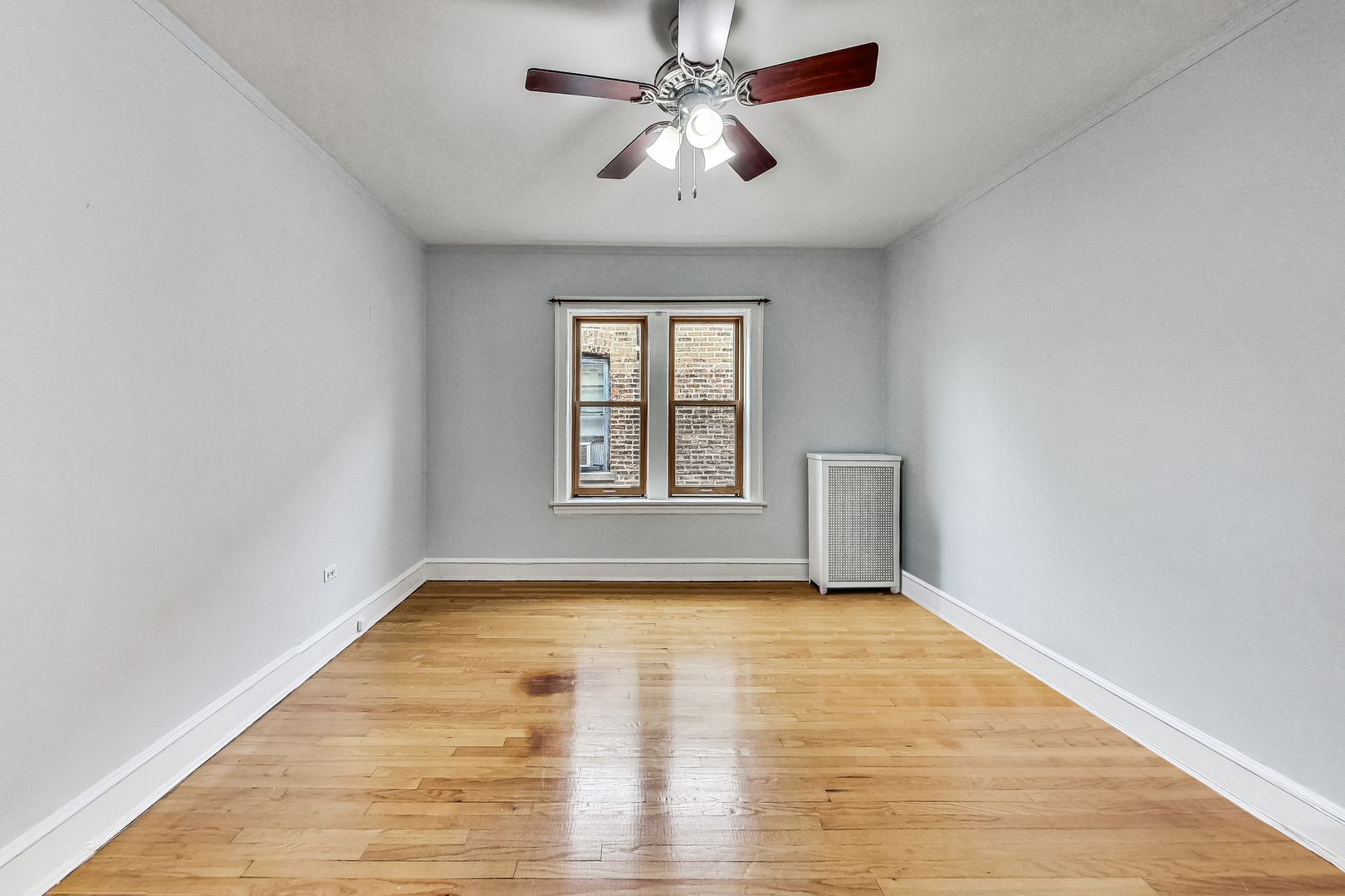 534 Sheridan Road, Unit 3B Evanston, IL 60202 - Photo 18 of 33 a view of empty room with wooden floor and fan