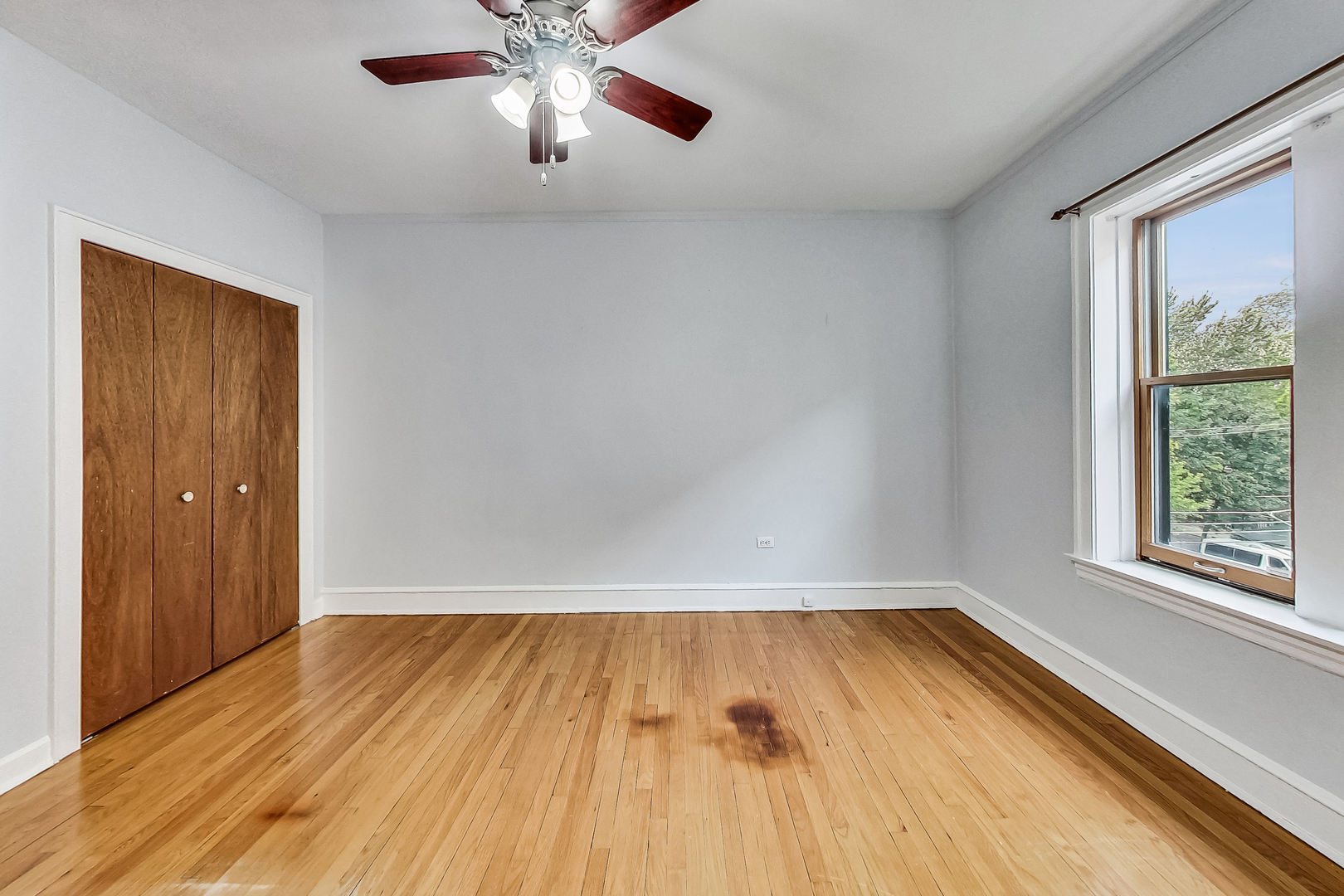 534 Sheridan Road, Unit 3B Evanston, IL 60202 - Photo 22 of 33 a view of room with window and wooden floor
