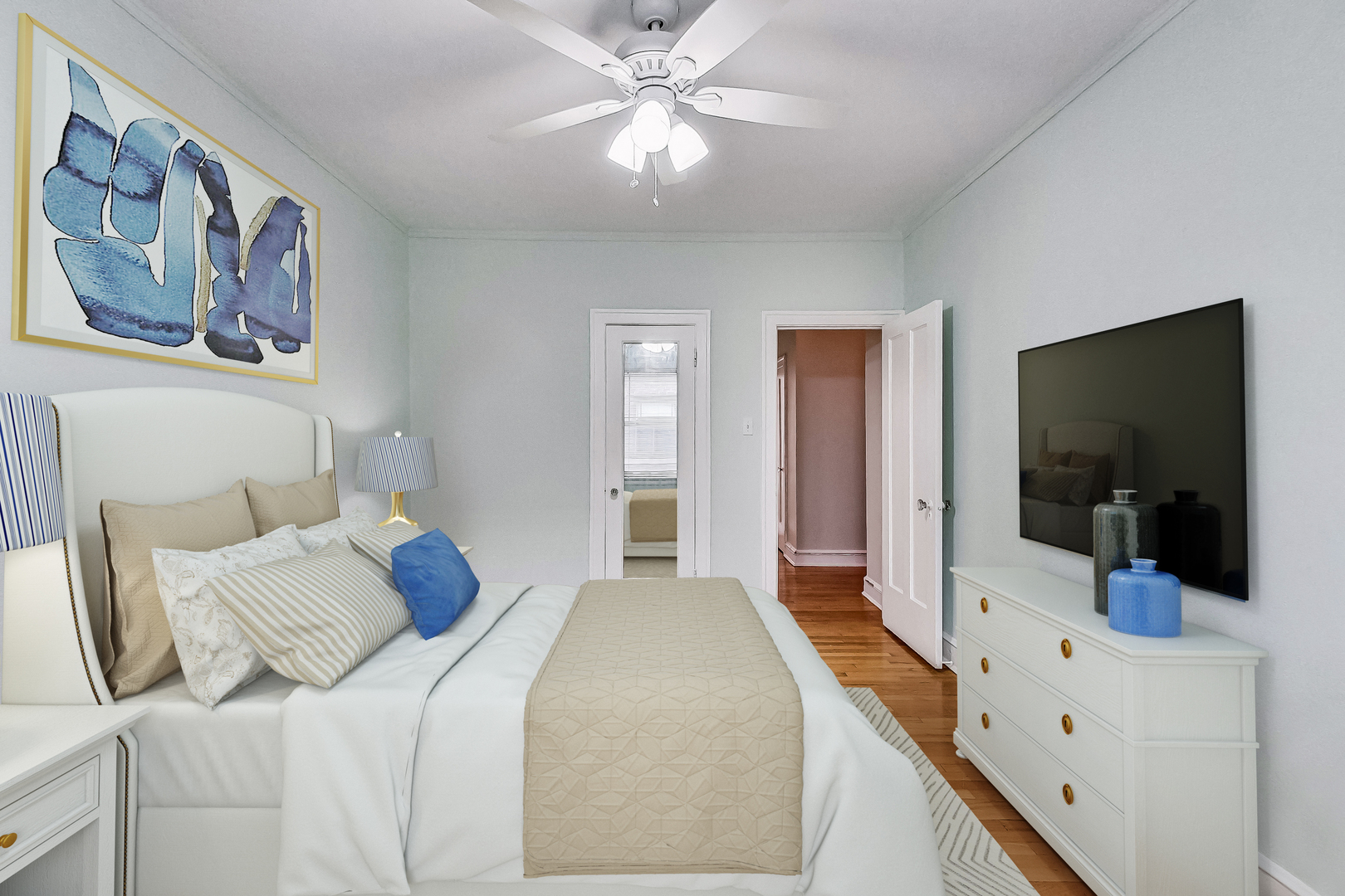 534 Sheridan Road, Unit 3B Evanston, IL 60202 - Photo 26 of 33 a bedroom with a large bed and a flat tv screen on dresser