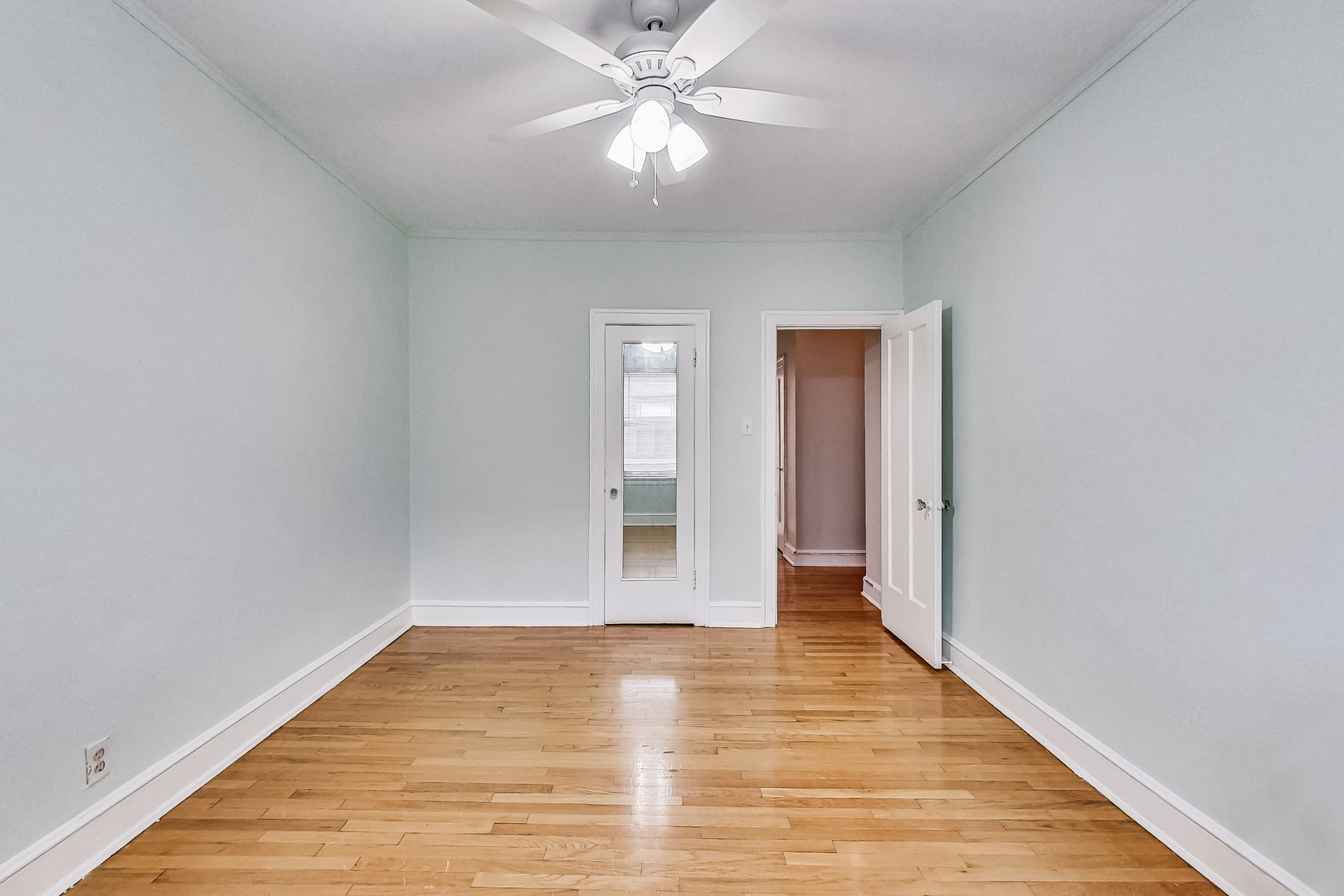 534 Sheridan Road, Unit 3B Evanston, IL 60202 - Photo 27 of 33 a view of an empty room and window and wooden floor